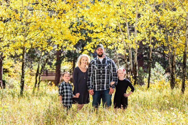 A UTSD Family Standing in a Field